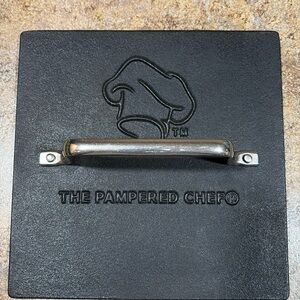 The Pampered Chef cast iron press, new w/o box.